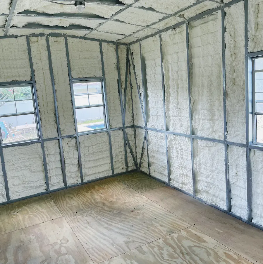 Closed-cell spray foam insulation applied to wall cavities in a residential project in Carteret